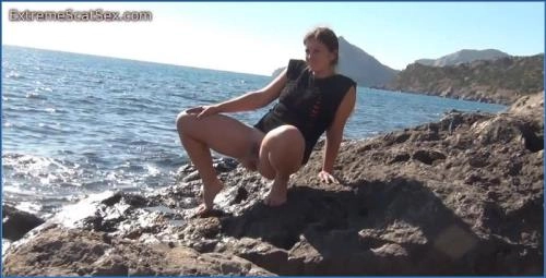 Nadya Craps Her Pants by the Sea in Scat Porn Video - related scat video at Scat-Slaves